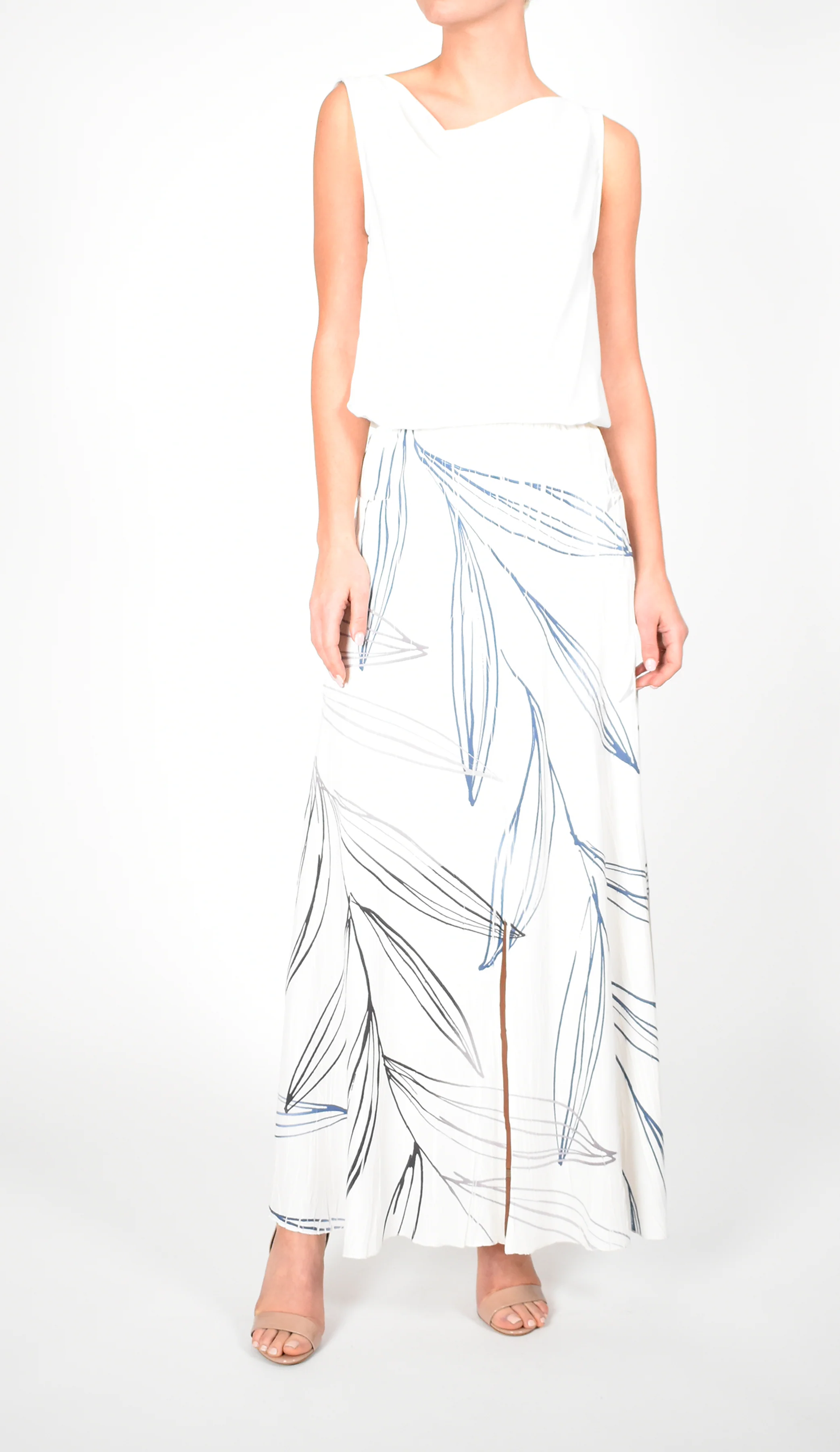 White Sleeveless Top and Leaf - Print Maxi Skirt Ensemble