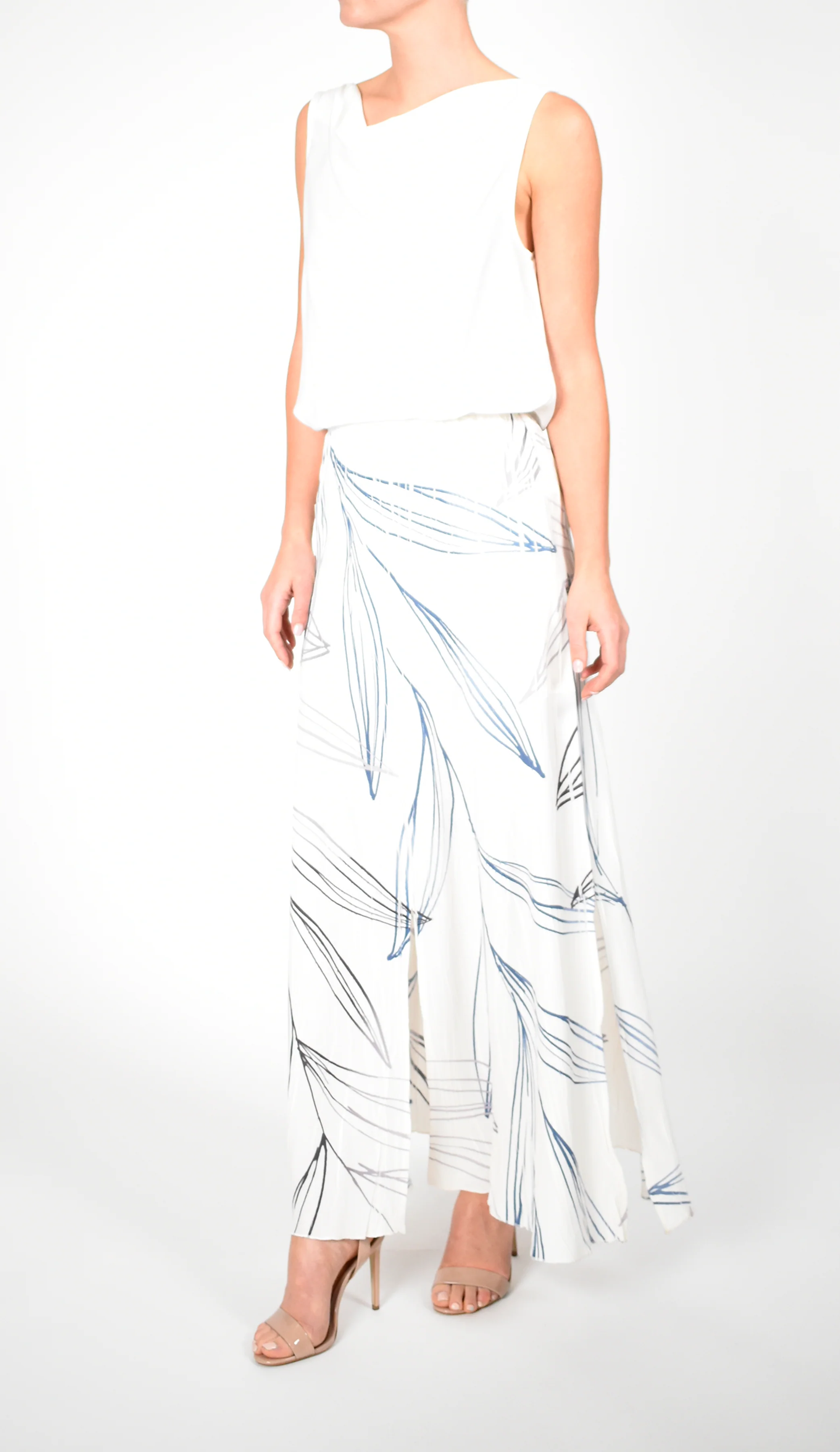 White Sleeveless Top and Leaf - Print Maxi Skirt Ensemble