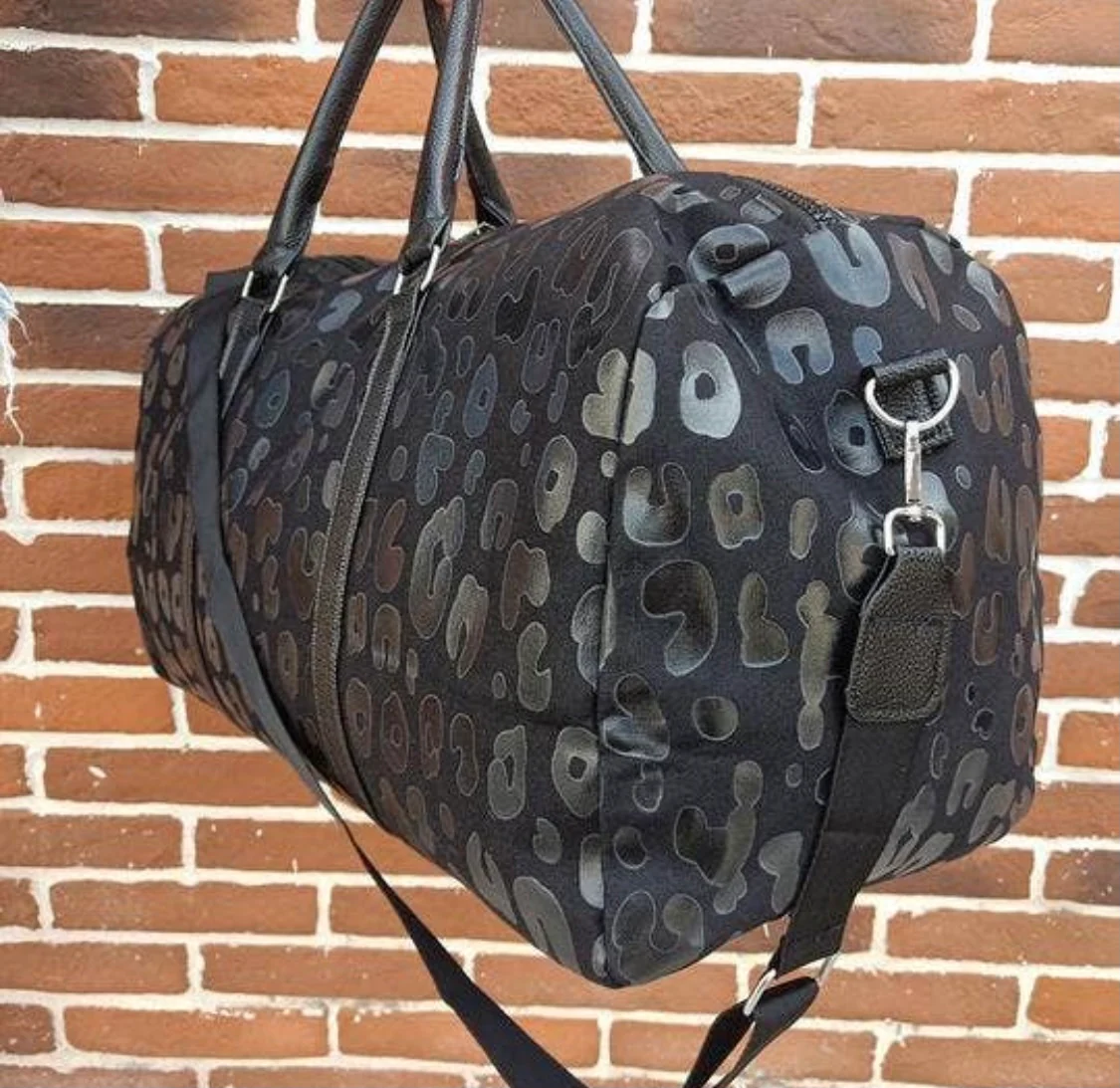 Black leopard getaway bag