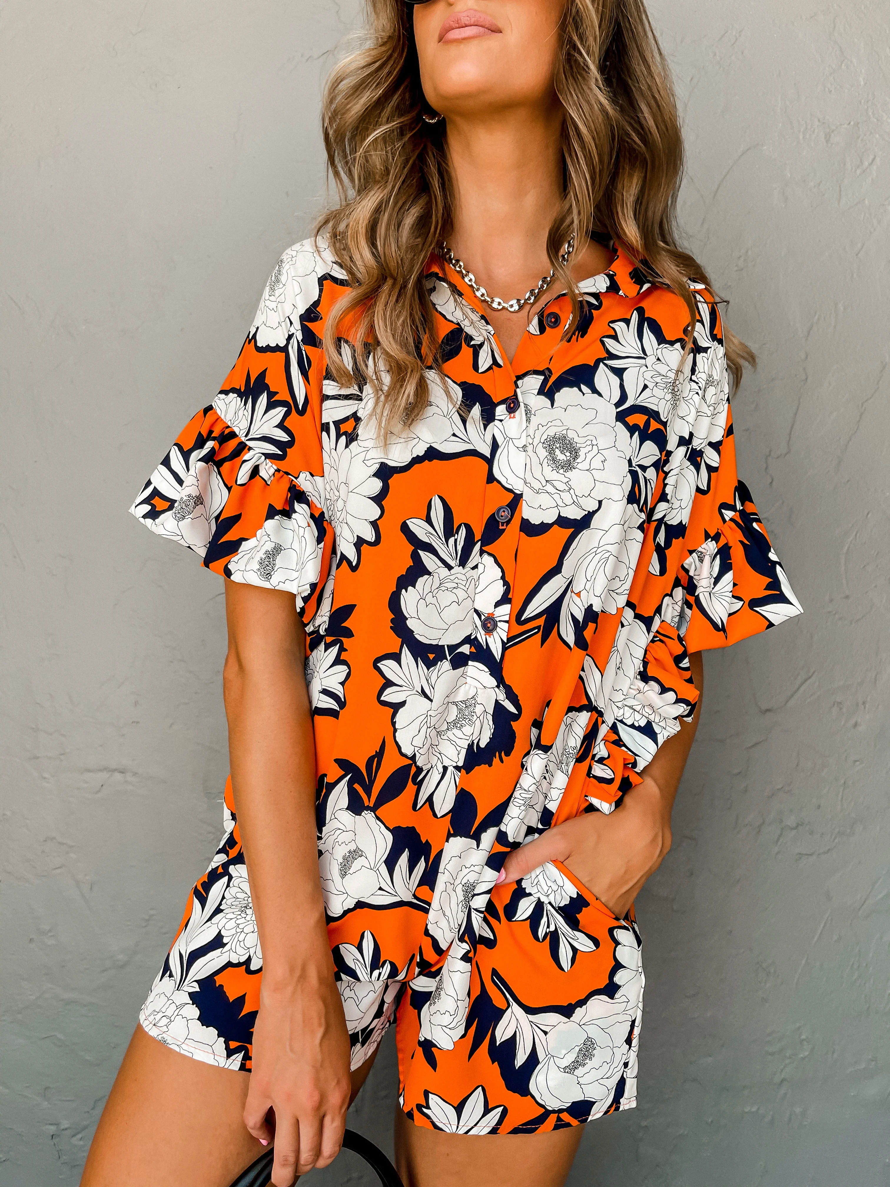 Blissful Beats Floral Ruffle Sleeve Romper